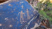 Load image into Gallery viewer, Carved into the desert varnish of a large boulder in Road Canyon, this rock art contains a mix of anthropomorphs and birds.